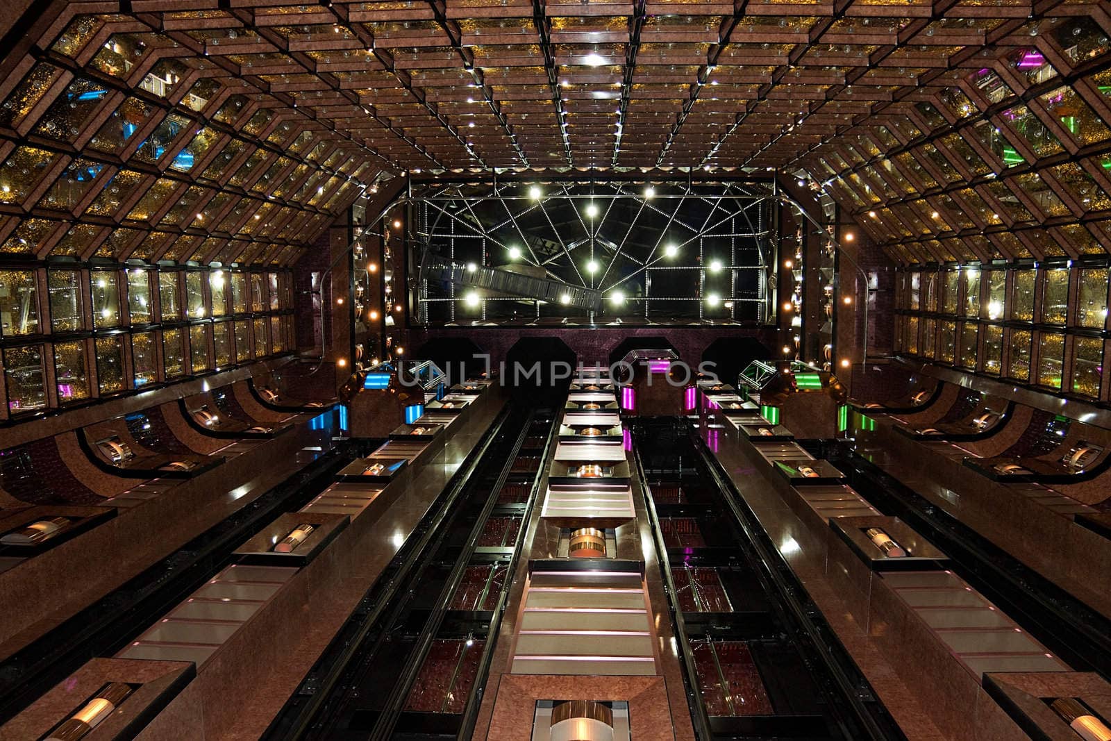 Large atrium with colorfully walls and elevators