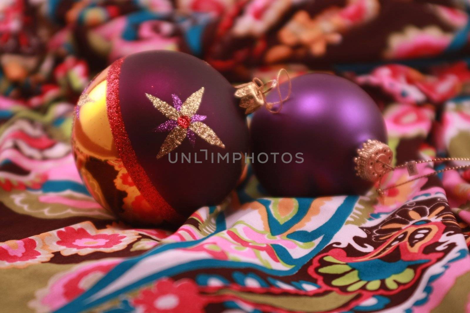 Colorful purple metallic Christmas ornaments for the holidays. Christmas tree decorations for the season.