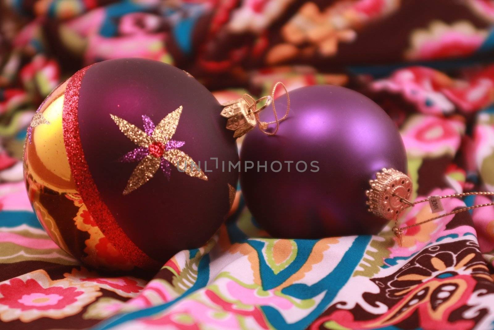 Colorful purple metallic Christmas ornaments for the holidays. Christmas tree decorations for the season.