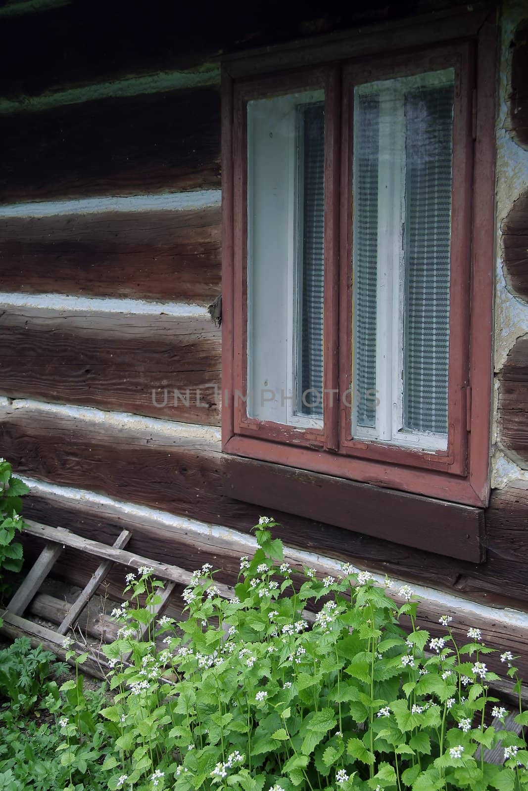old wooden village house, window detail