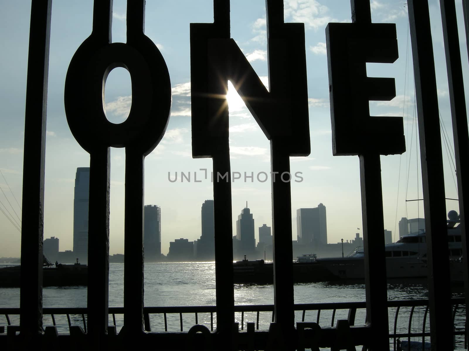 word ONE made as rail, photo taken in New York, New Jersey in distance