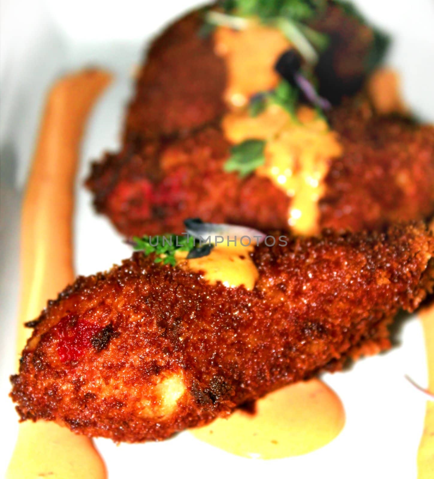 Appetizer plate of spicy fried jalapeno poppers