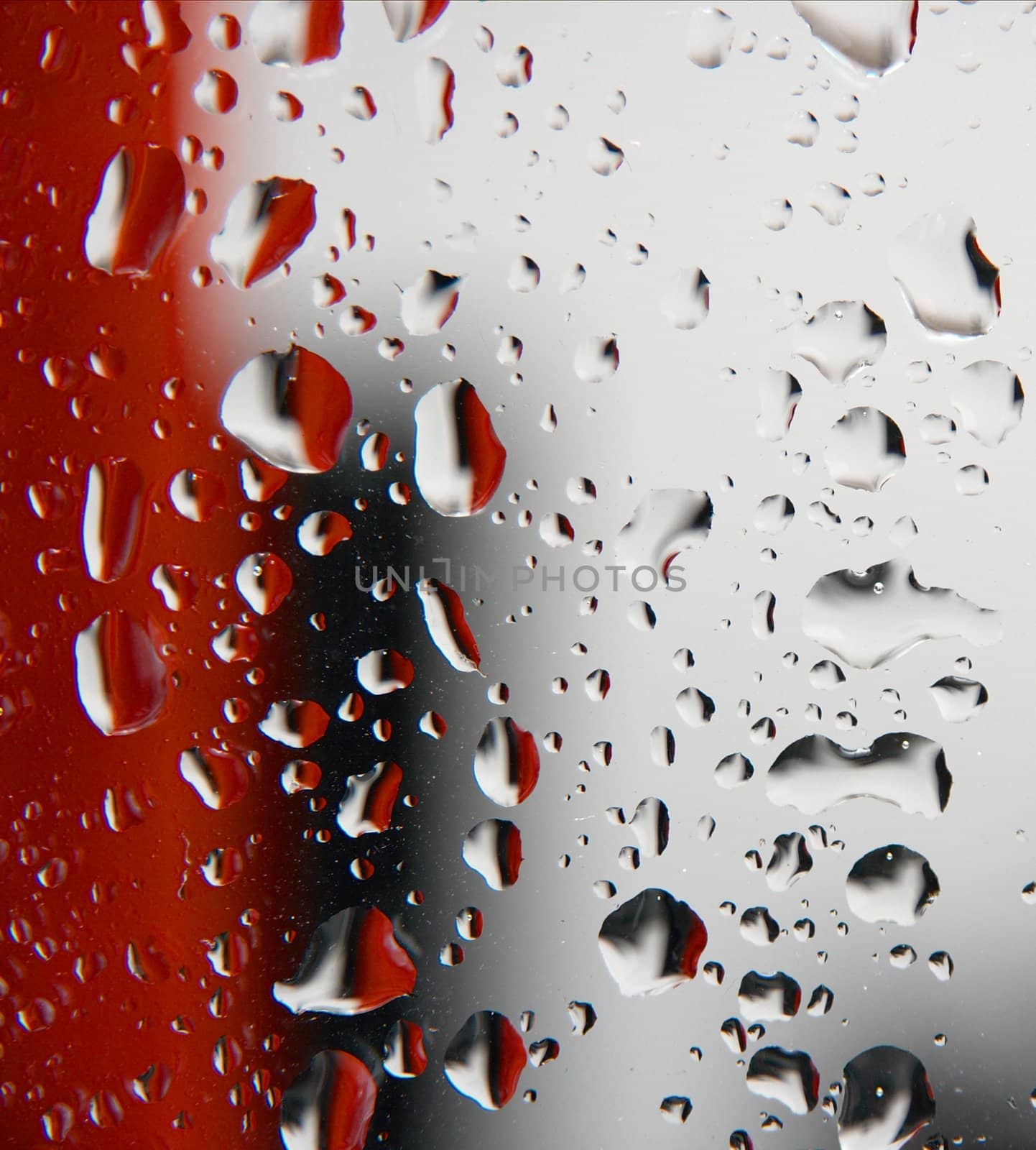 Raindrops on a glass surface, red, black, white background