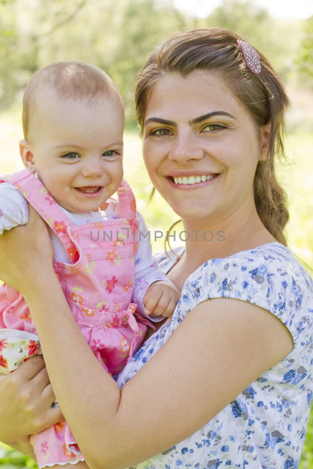 Happy mother with child by manaemedia