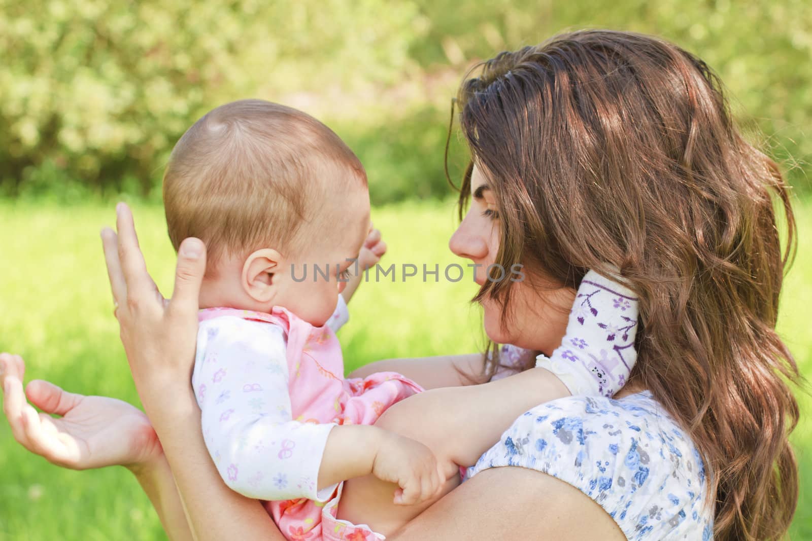 Happy mother with child by manaemedia