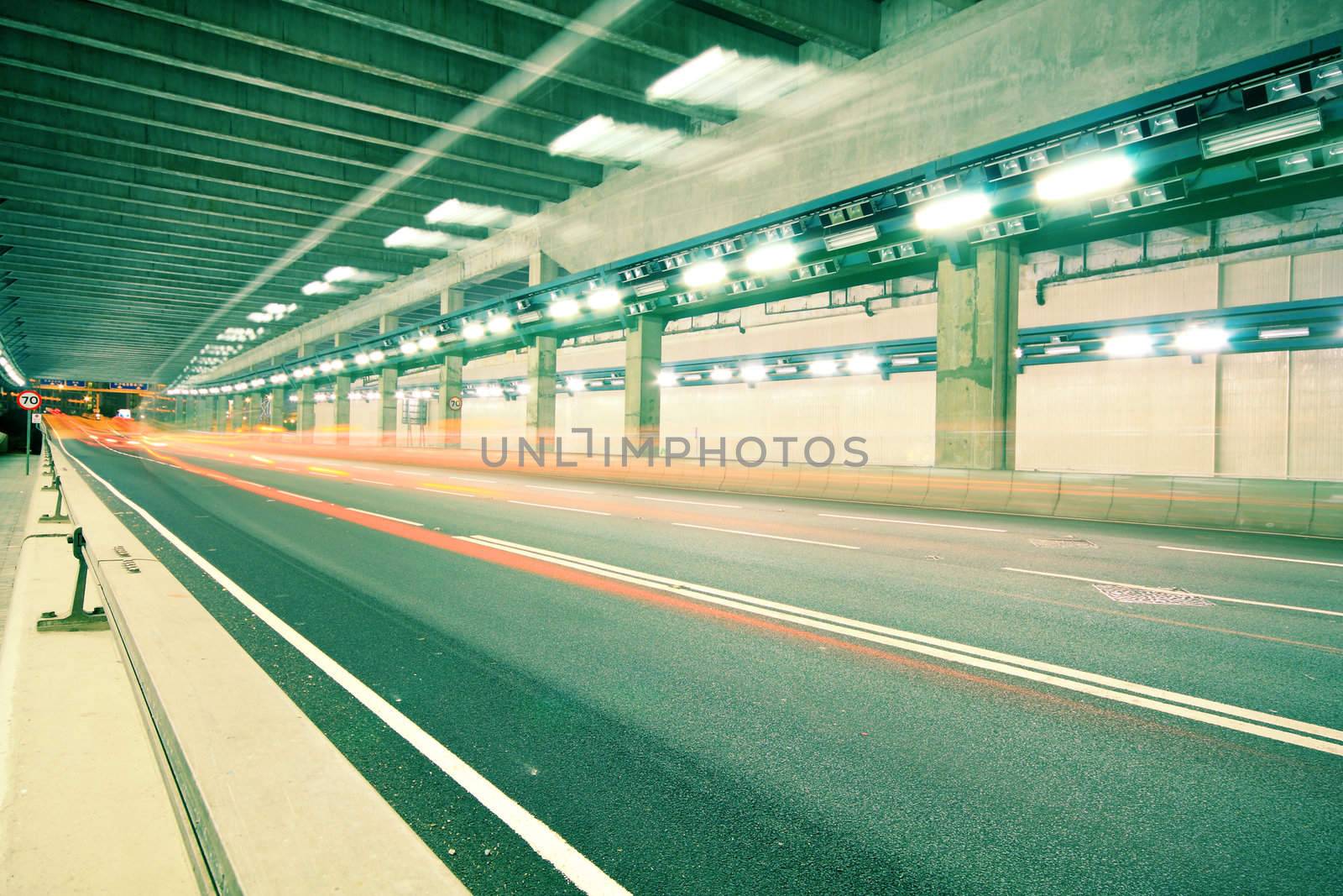 blurred bus light trails in downtown night-scape in hongkong.
