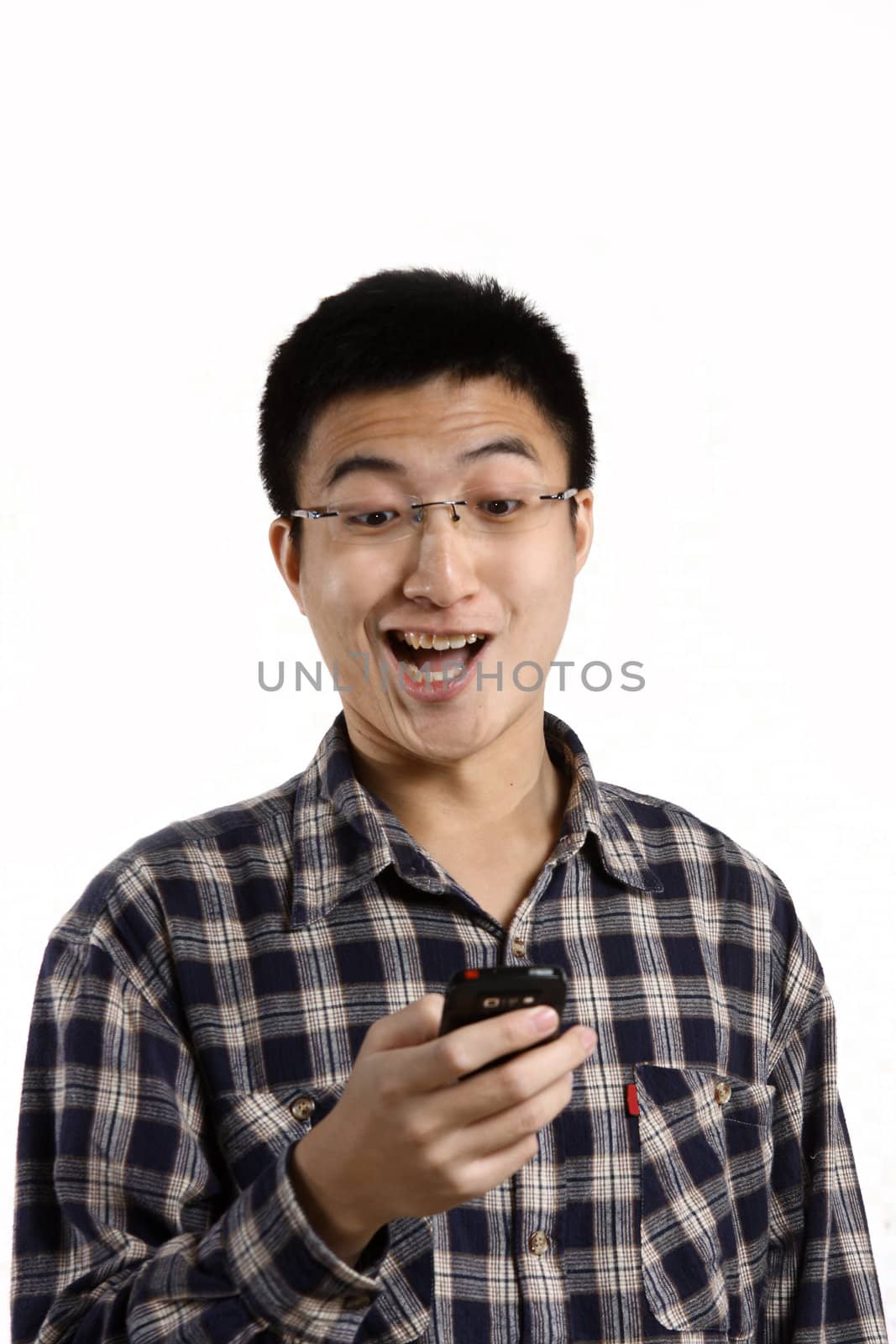 casual man smiling feel surprised on a mobile phone isolated ove by cozyta