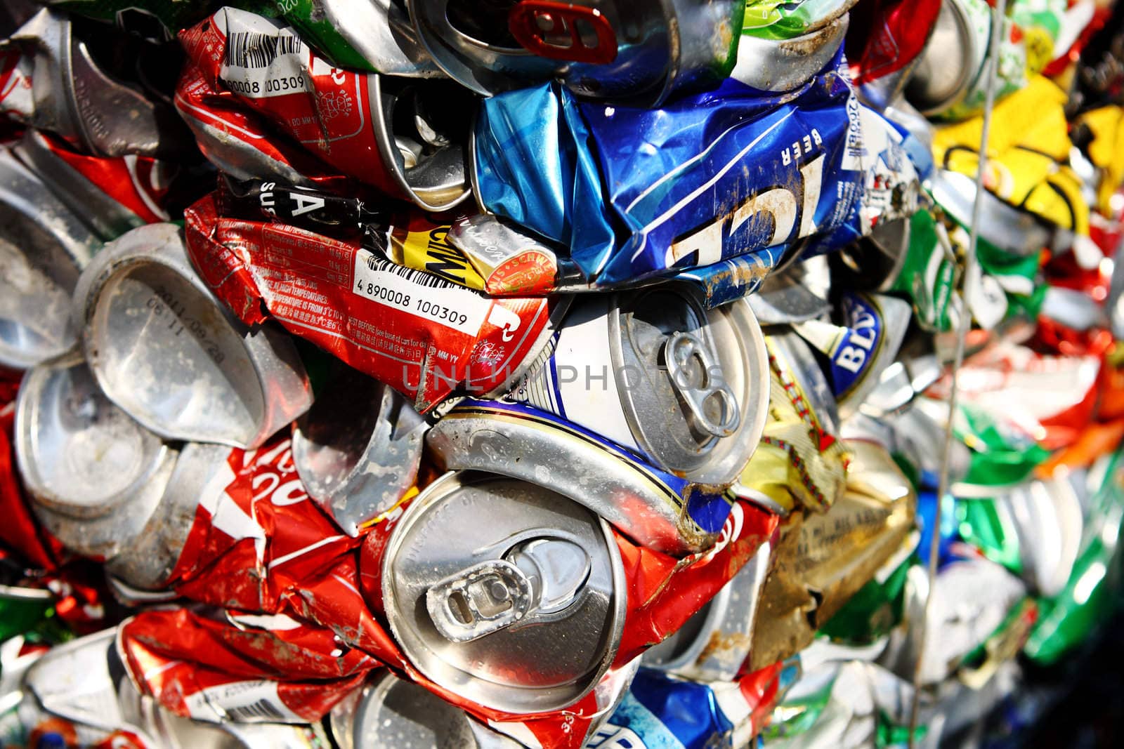 Compressed beer can background close up