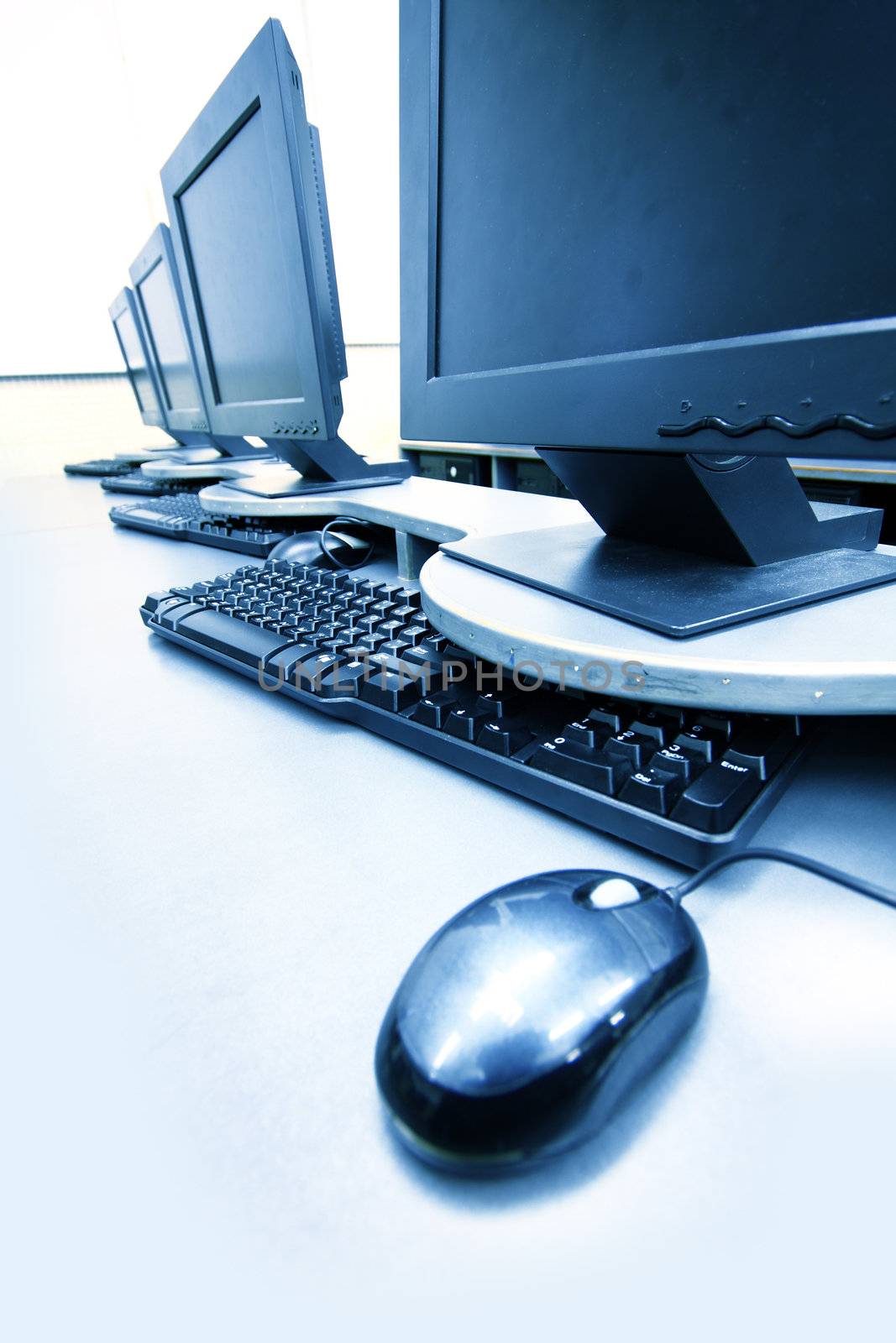 workplace room with computers in row close up