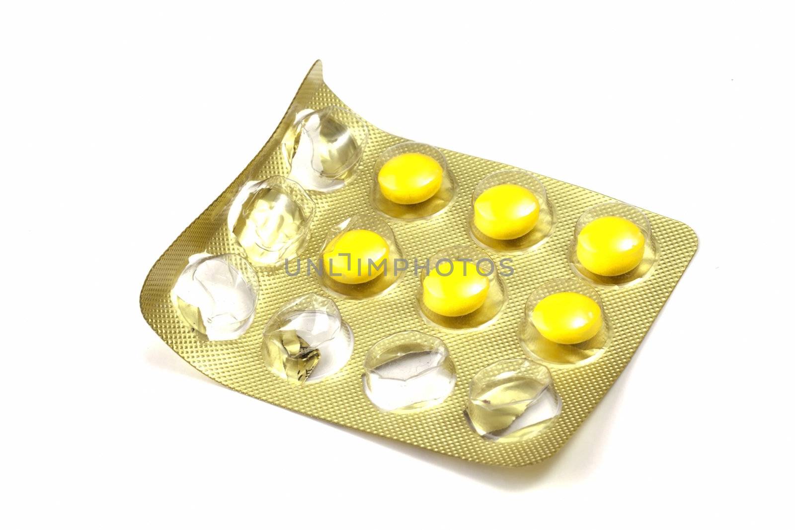 Package of Yellow Pills isolated on white