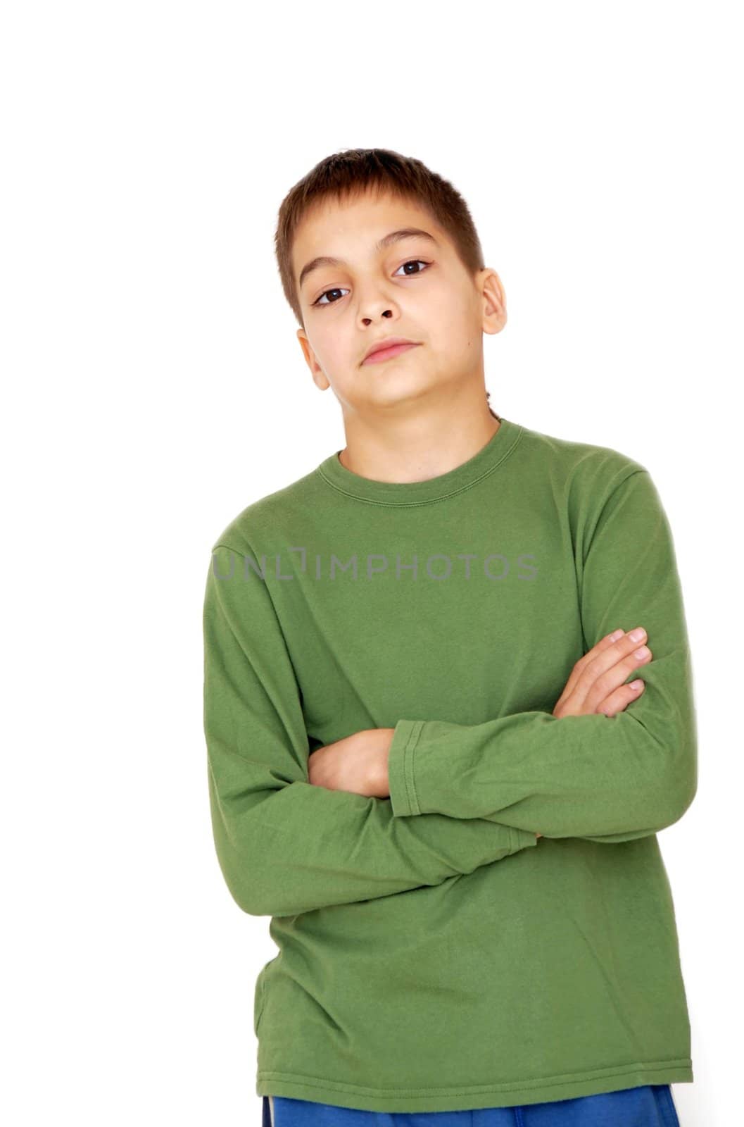 teenage boy with crossed arms on white background