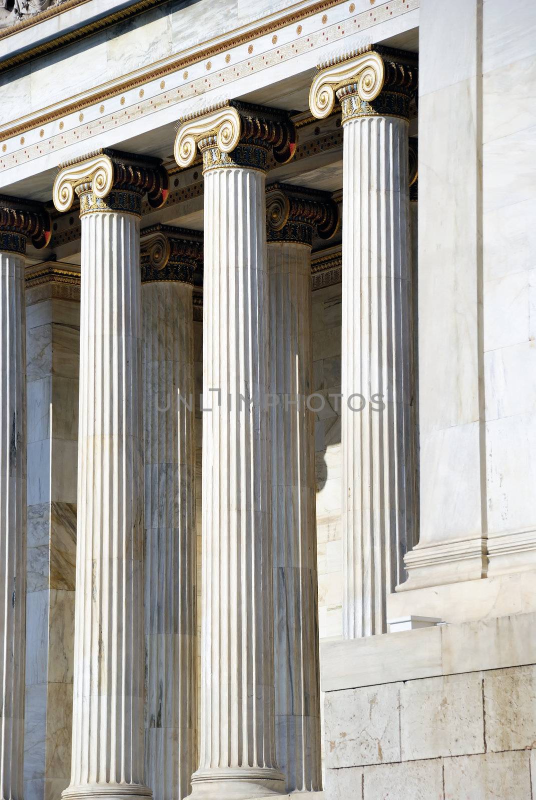 Detail of The National Academy Building in Athens showing colossal columns of the building. The building, which was built from 1859 - 1885, is located on the south of The University of Athens' main building (Panepistimiou street)