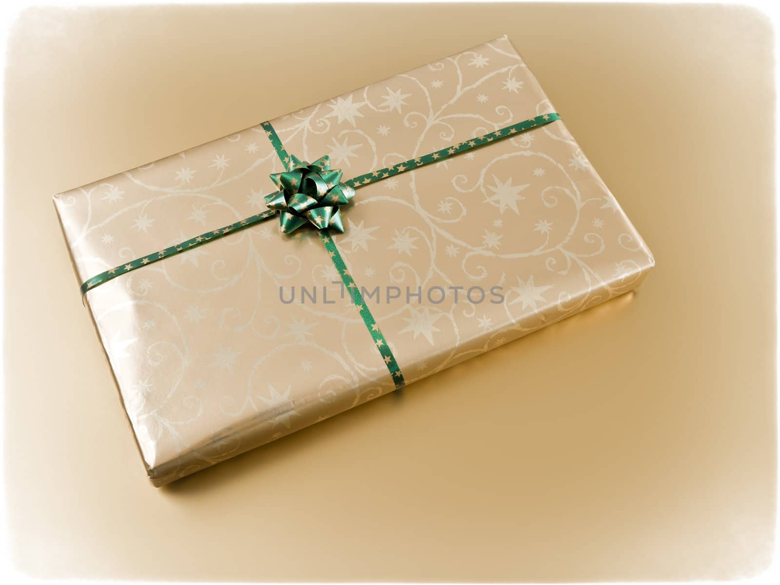 An image of a nice present on golden background