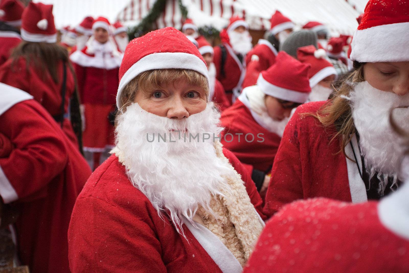 RIGA, LATVIA - DECEMBER 12: Participants of the third annual Santas Fun Run &amp; Walk in Riga, Latvia, 12 December, 2010