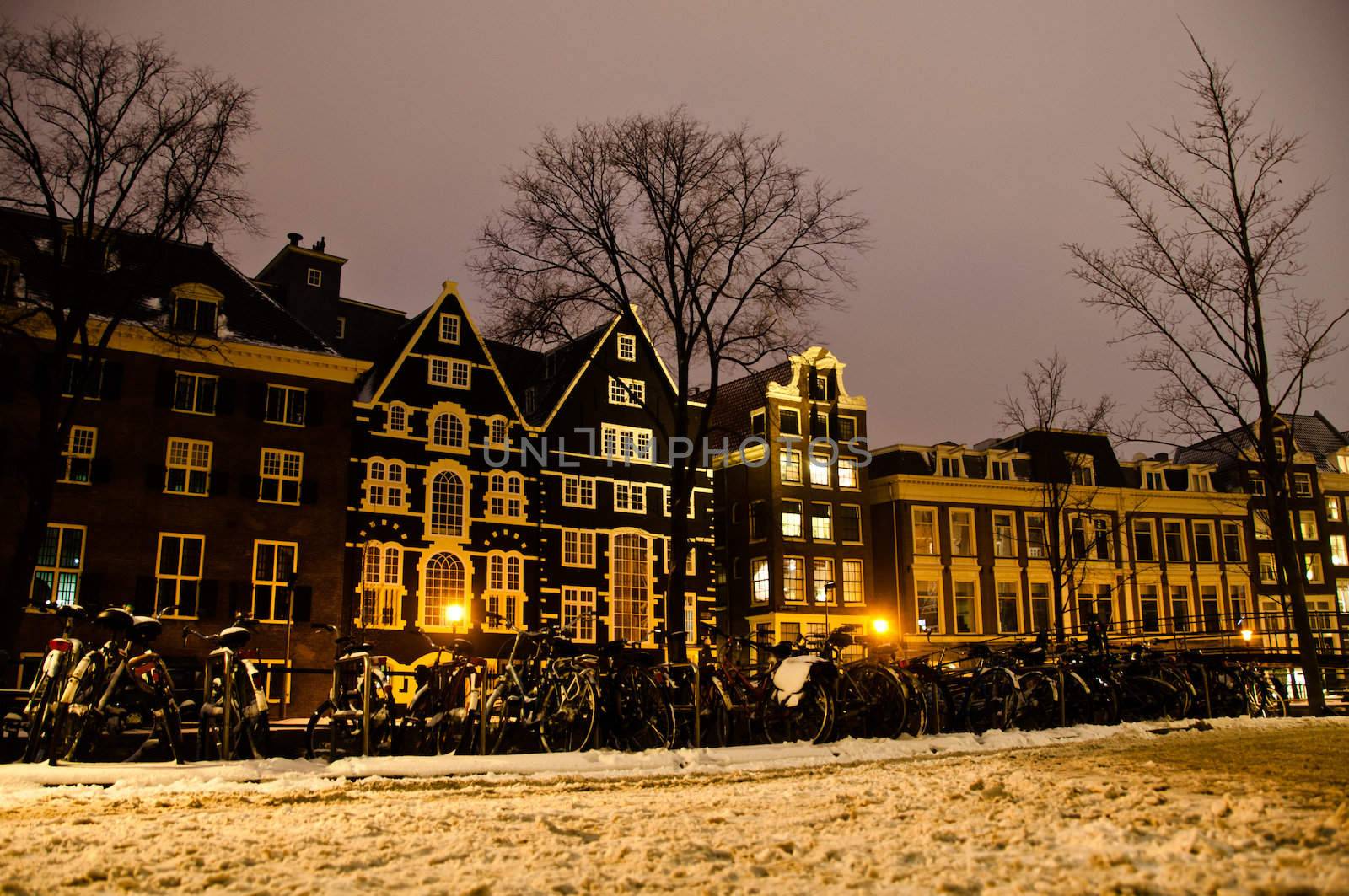 Amsterdam canals and typical houses on a snowy winters night