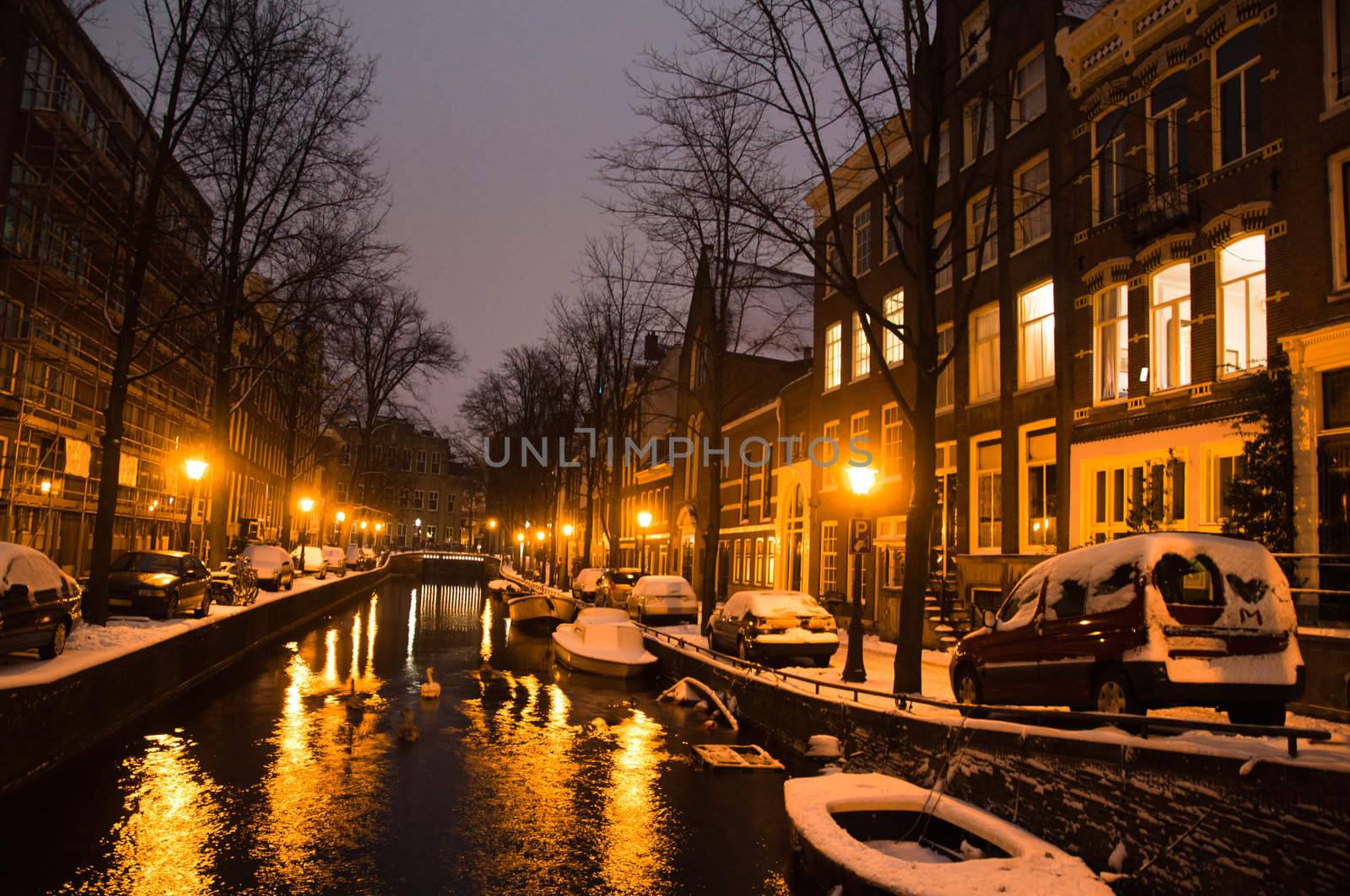 Amsterdam canals and typical houses on a snowy winters night