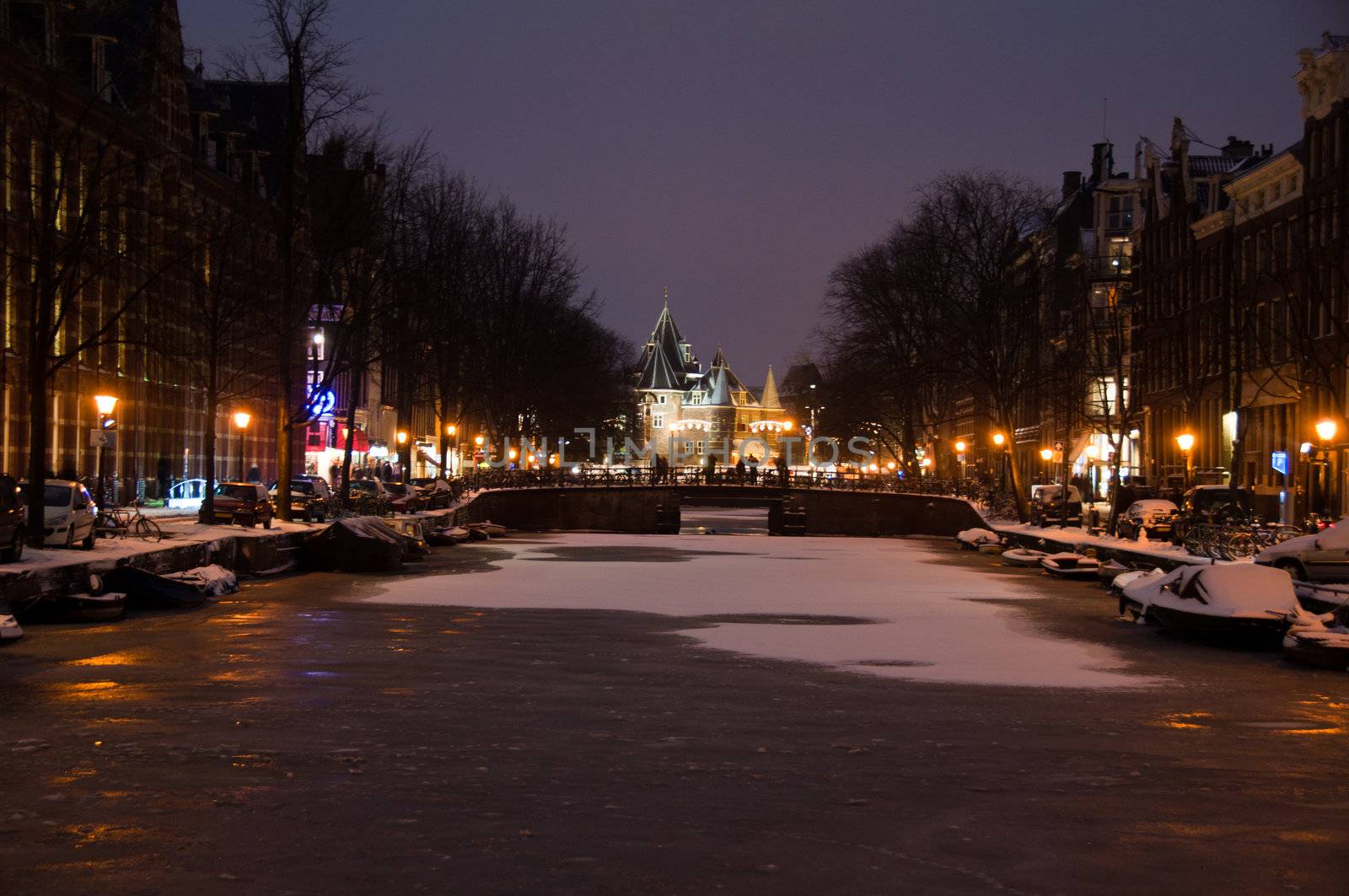 Amsterdam canals and typical houses on a snowy winters night