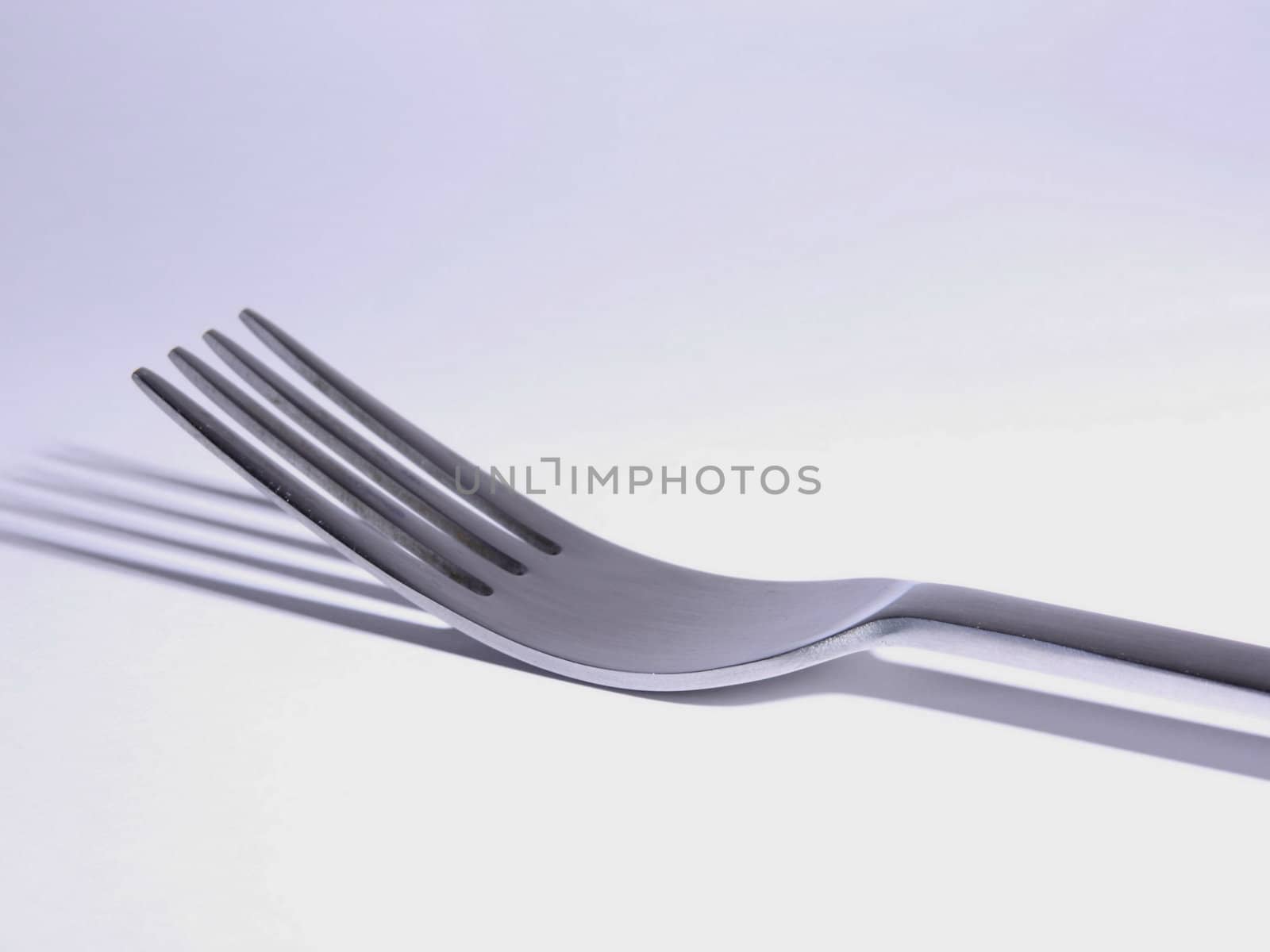 close-up of an eating silver fork. isolated 