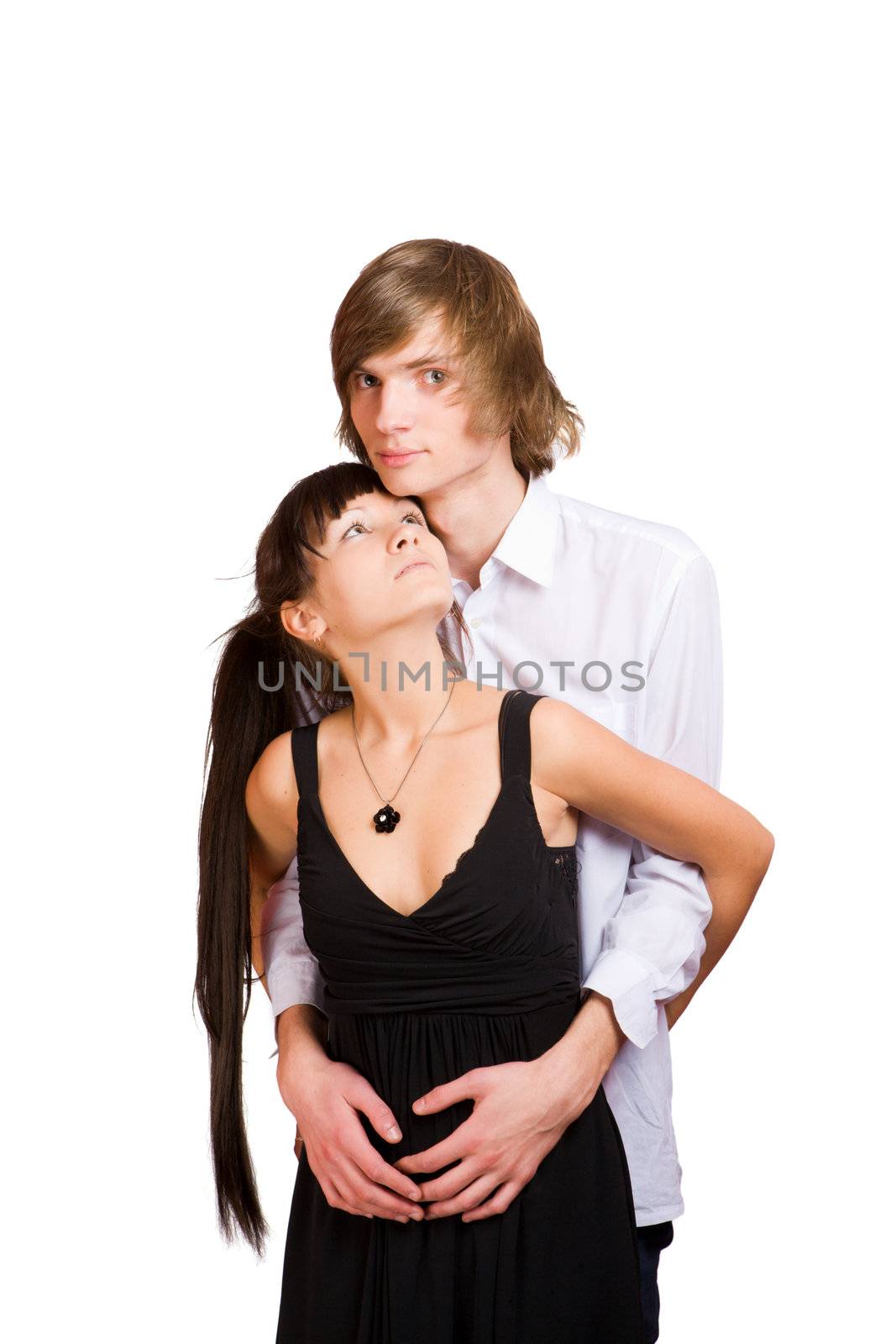 Young beautiful teenage couple holding together isolated