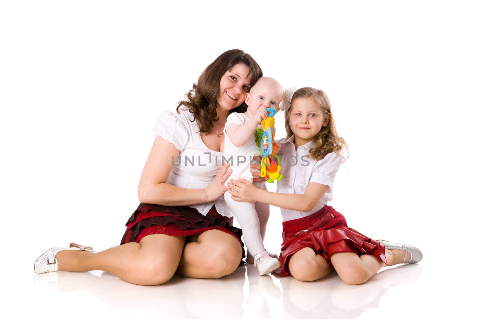 Mother with daughters sitting together isolated on white