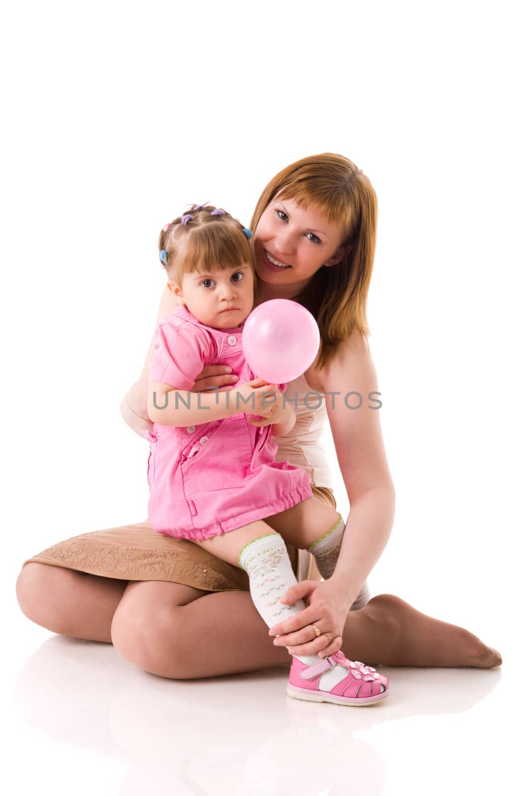 Mother with two years daughter together isolated on white