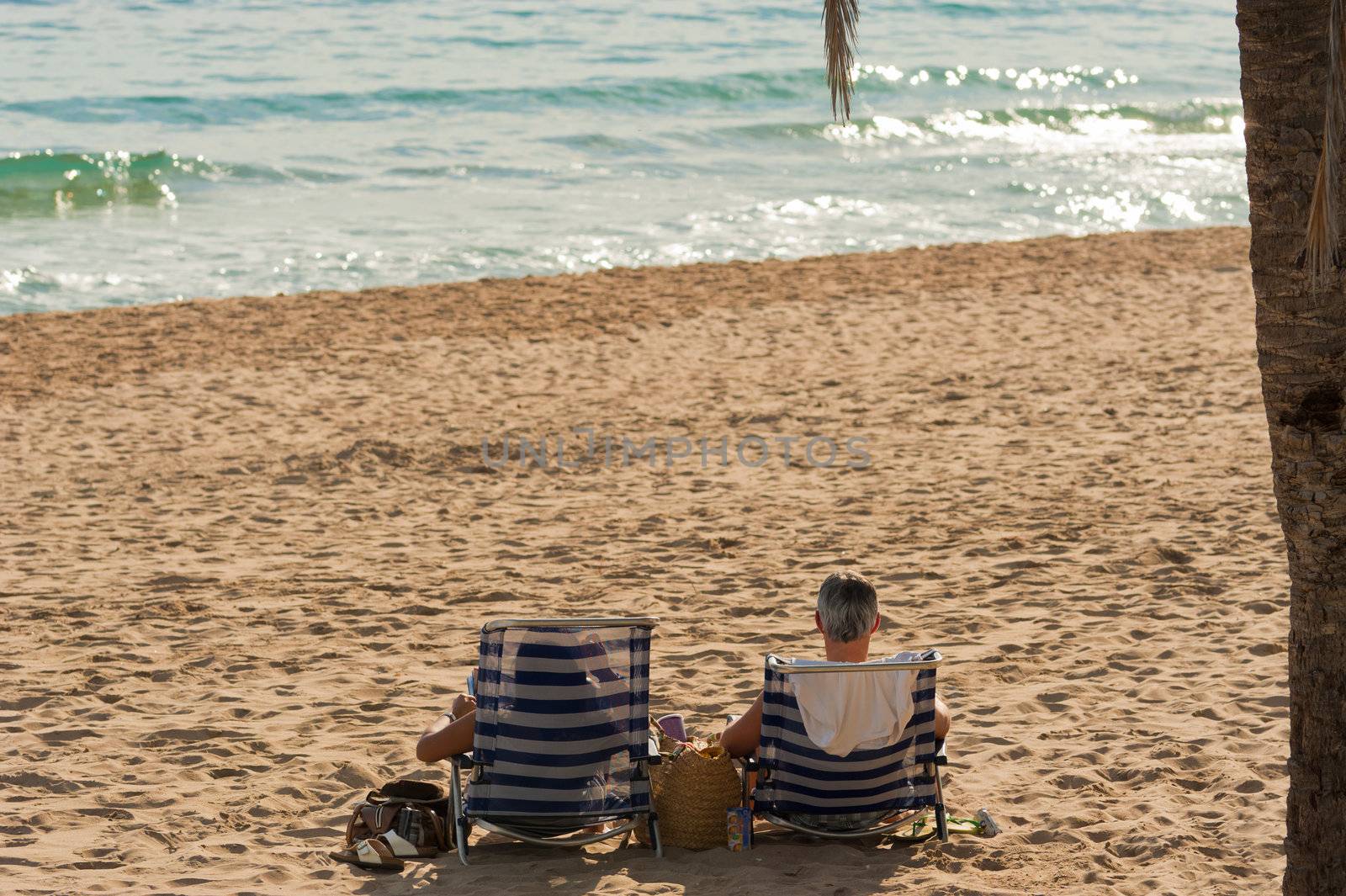 Retired couple enjoying life on a beach 
