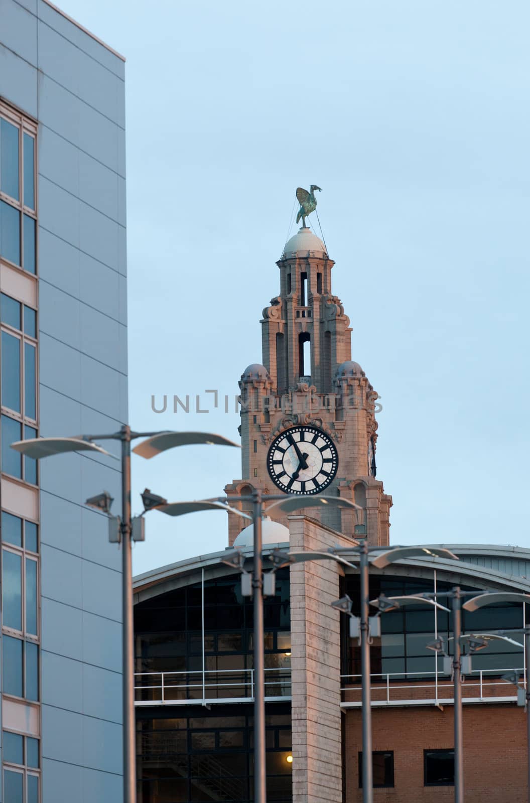 Liver building on waterfront in Liverpool, England with modern building in foreground
