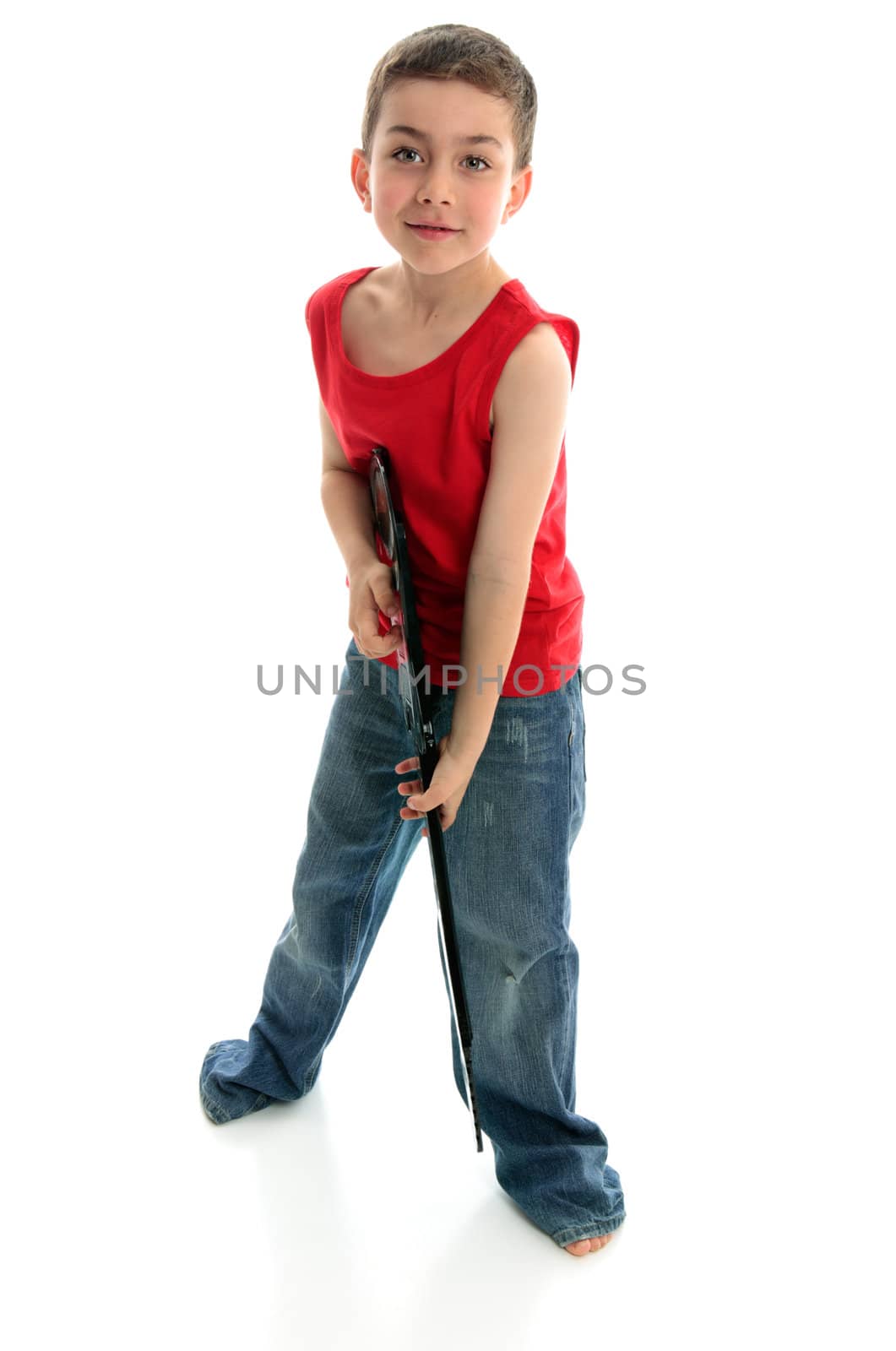 A little boy playing a guitar.  White background.