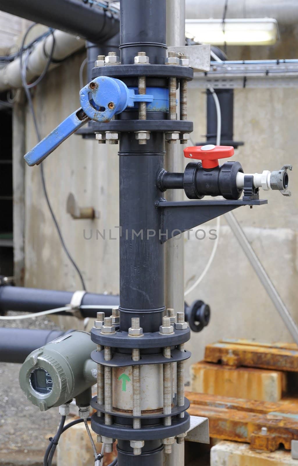 Industrial black plastic tube with some floodgates and pumps
