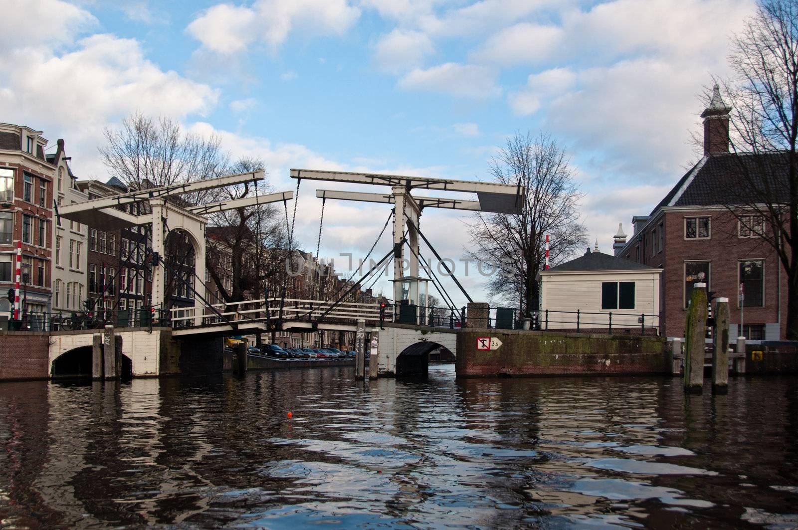 Typical wooden drawbridge over a canal in Amsterdam, Netherlands