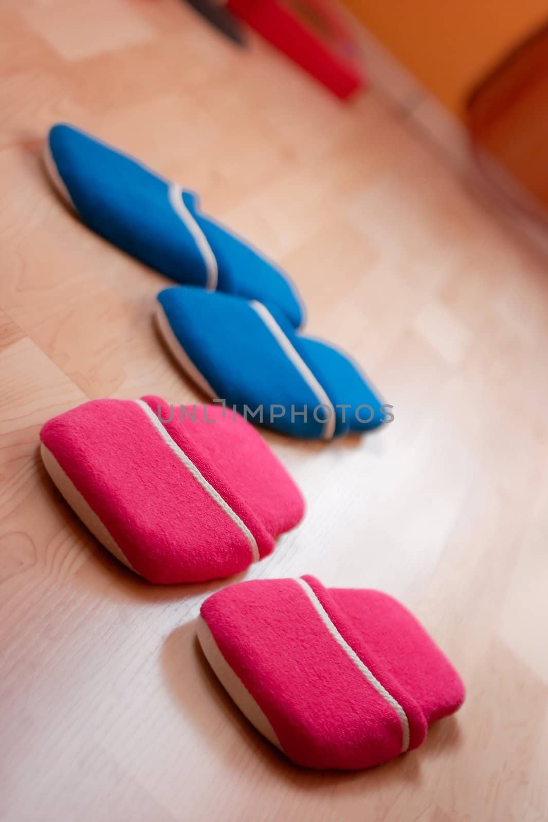 Red and blue slippers on the floor