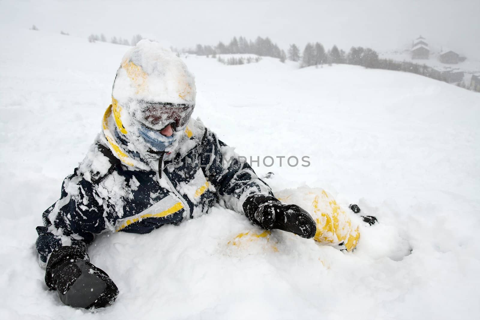 Skier in the snow after falling over