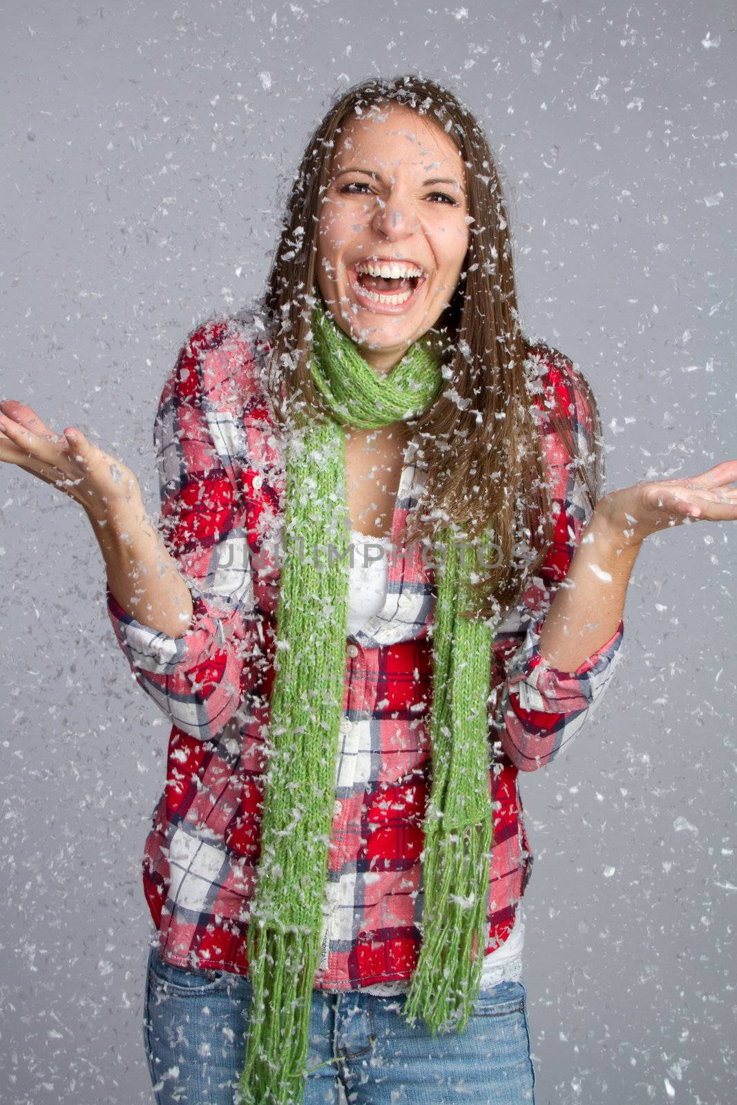 Beautiful girl playing in snow