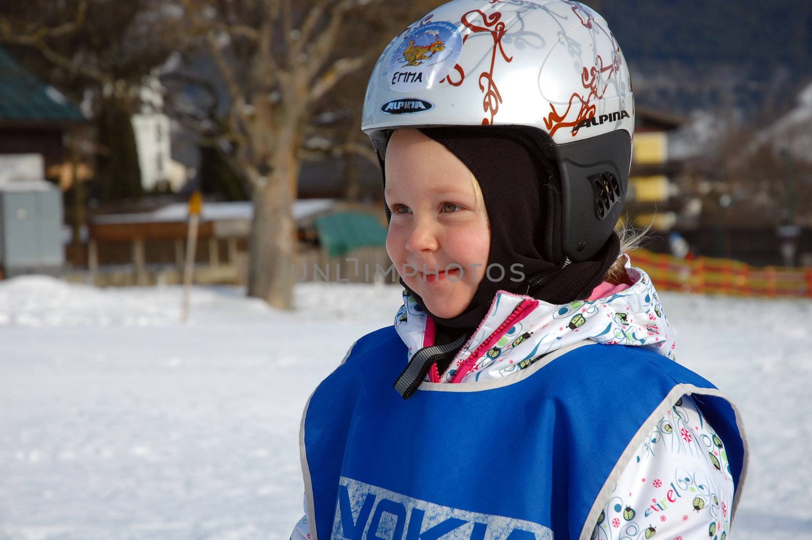 ZELL AM SEE, AUSTRIA - DECEMBER 22: Three year old girl at Ski school in Zell am See, Austria. Austrian ski schools are famous for the training plans, that guarantees the safety of about 10 million ski drivers on austrian ski areas per year.