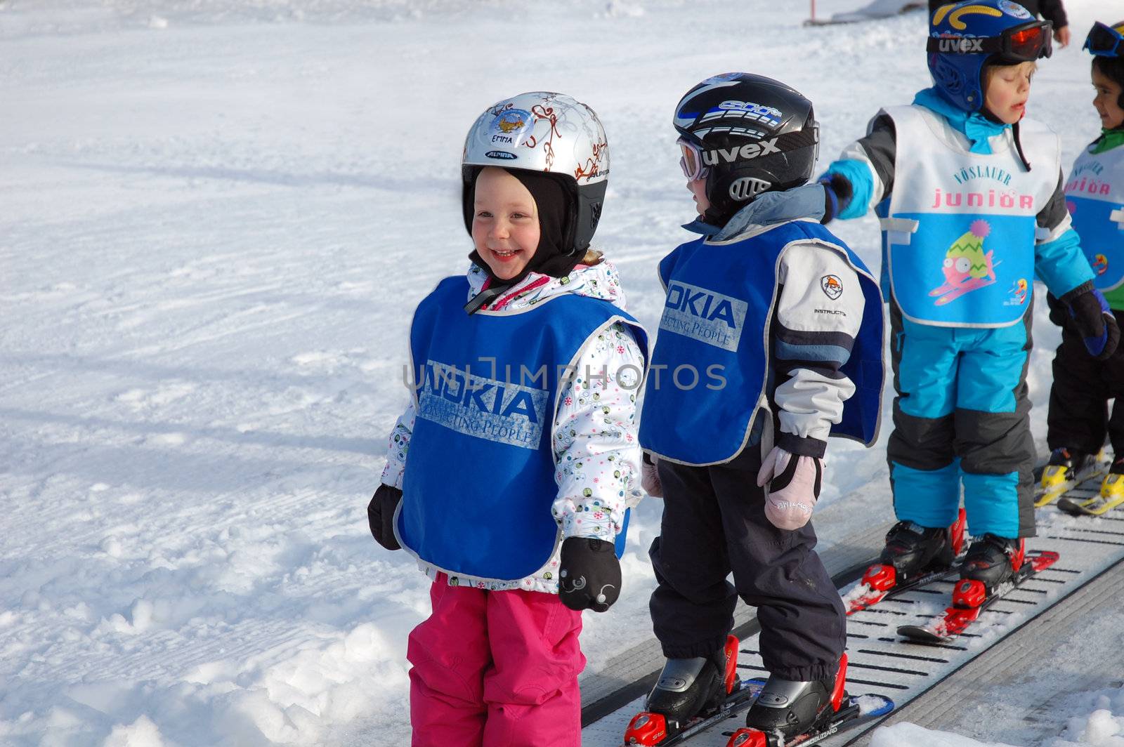 ZELL AM SEE, AUSTRIA - DECEMBER 22: 3-5 year old children at Ski school in Zell am See, Austria. Austrian ski schools are famous for the training plans, that guarantees the safety of about 10 million ski drivers on austrian ski areas per year.