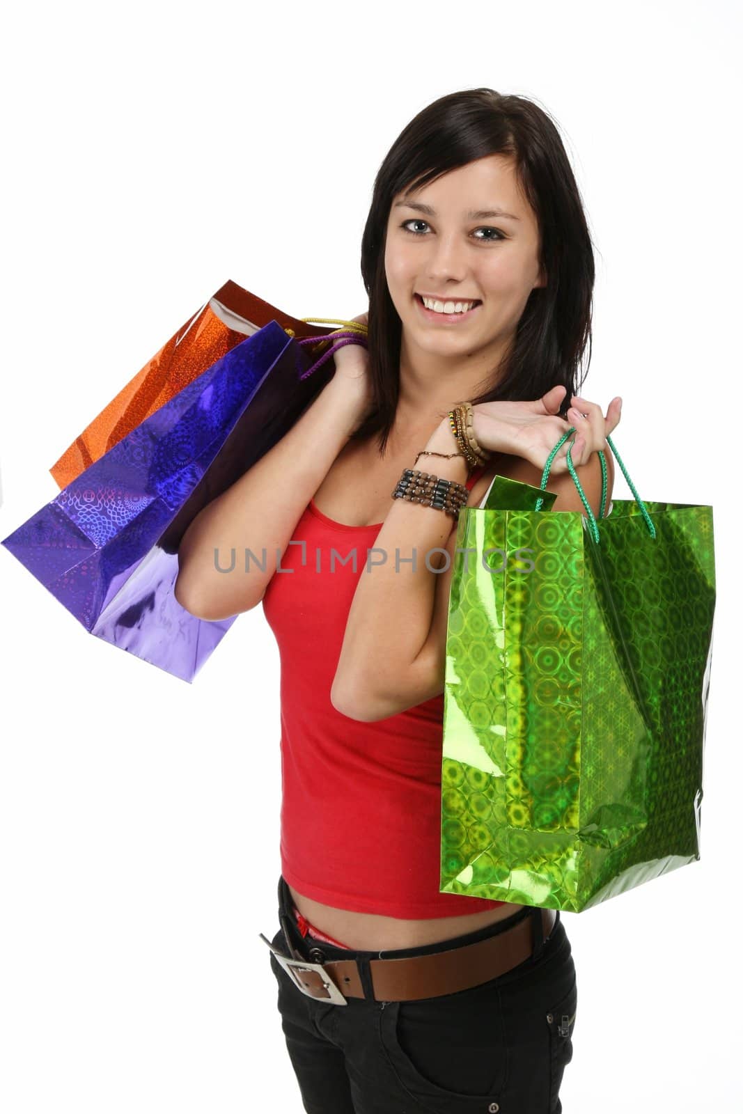 Pretty brunette shopping girl with colorful carry bags