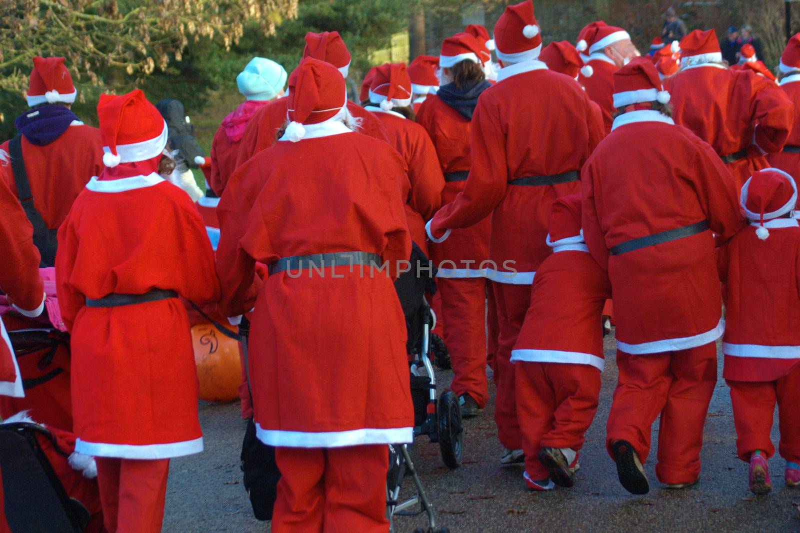 Group of santas entering fun run