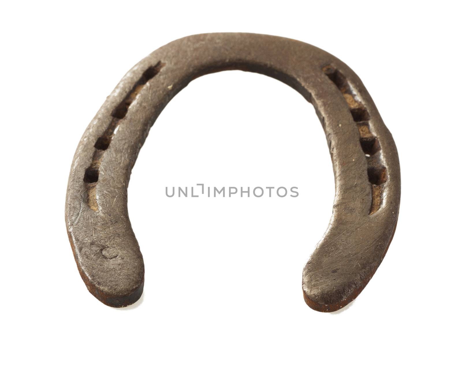 An iron horseshoe isolated over white background