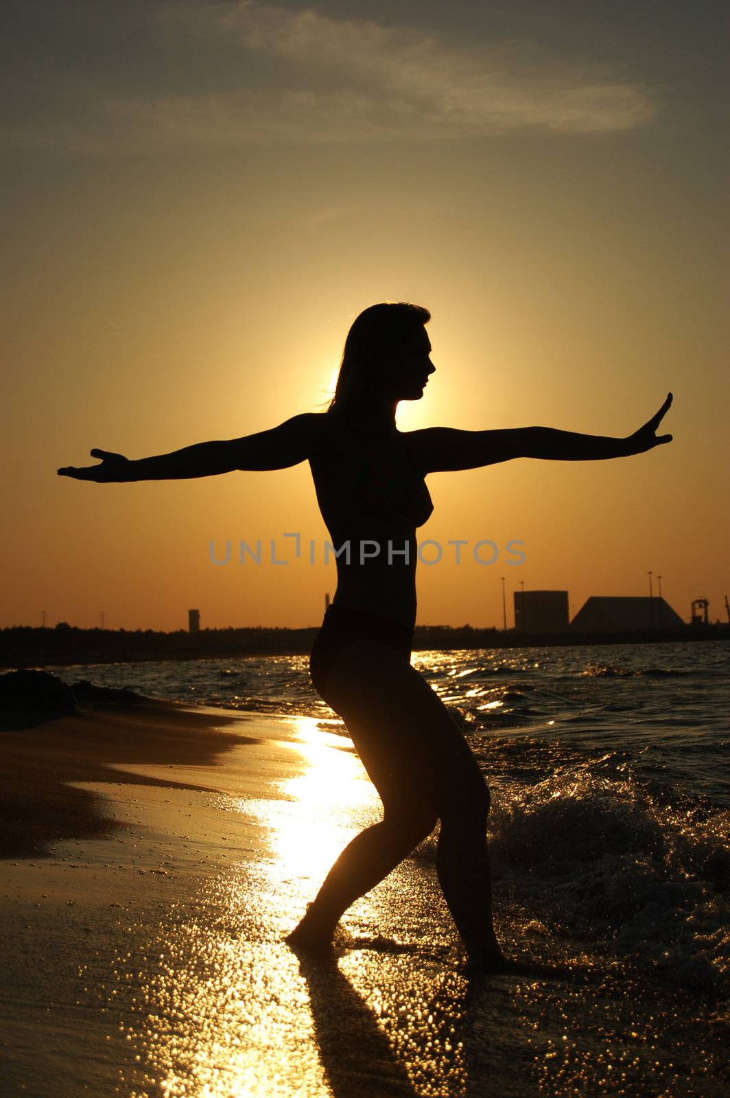 Sunset Tai-Chi on a beach by johnnychaos