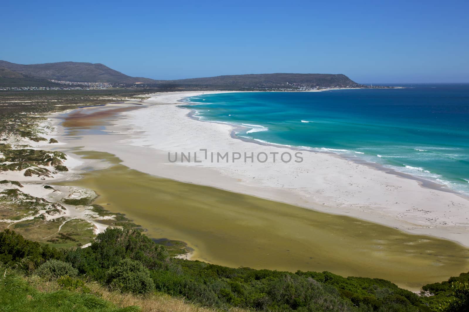 The expanse of Long Beach, with Kommetjie in the background, Cape Peninsula, South Africa.