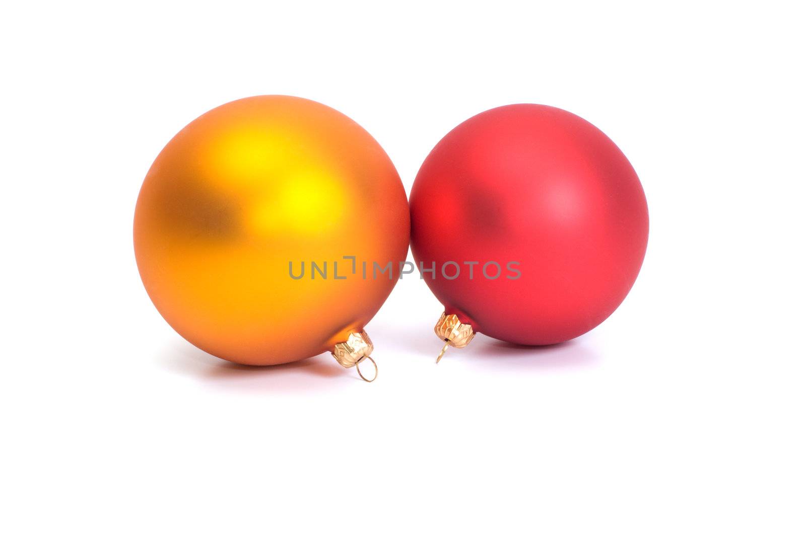 Red and yellow Christmas balls on white background.