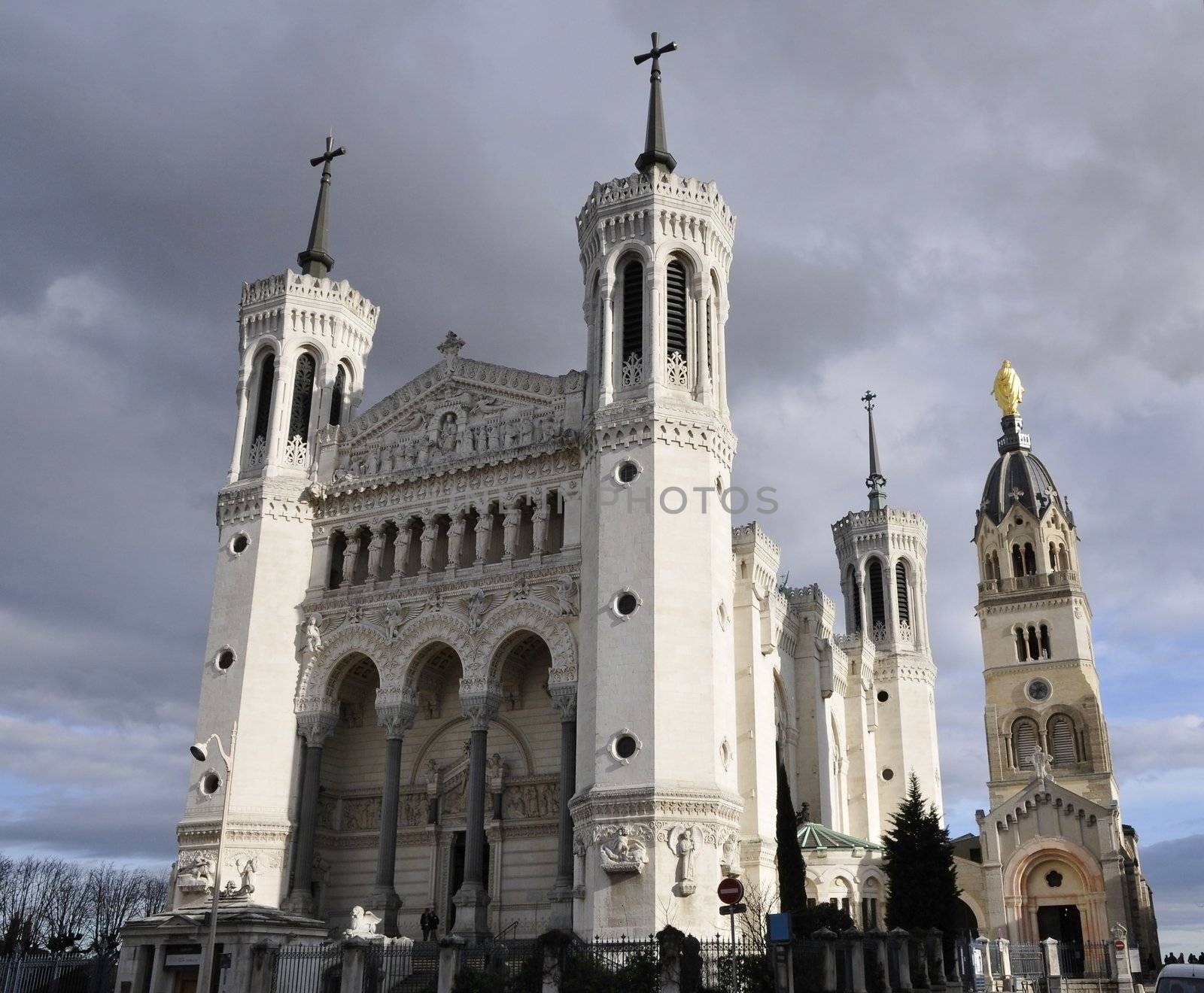 Large view of Fourviere cathedral in Lyon city with a cloudy sky
