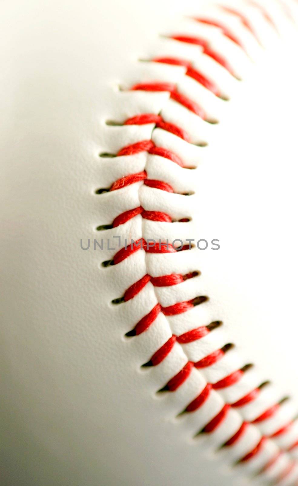 white leather base ball with red stitching