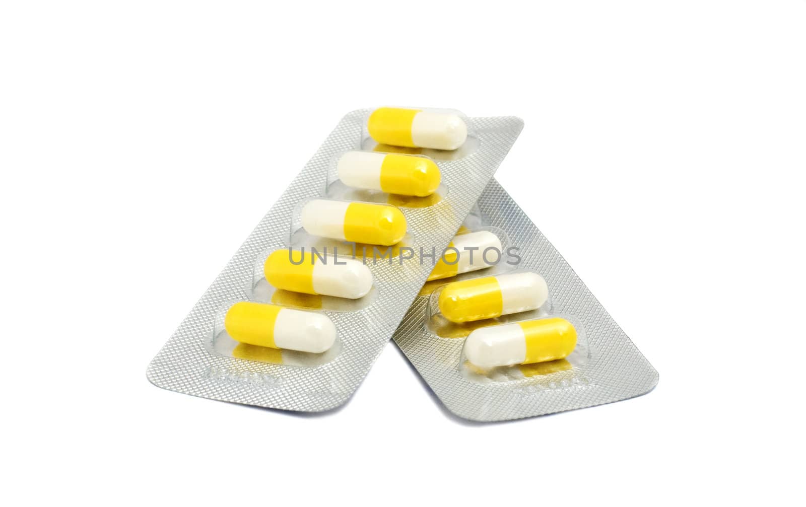 capsules of antibiotic drug in blister pack, isolated on white