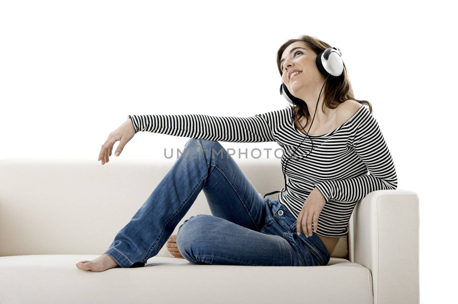 Beautiful happy woman listen music with headphones