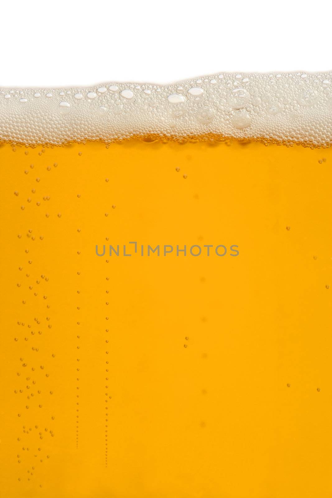 A macro image of a glass of beer.
