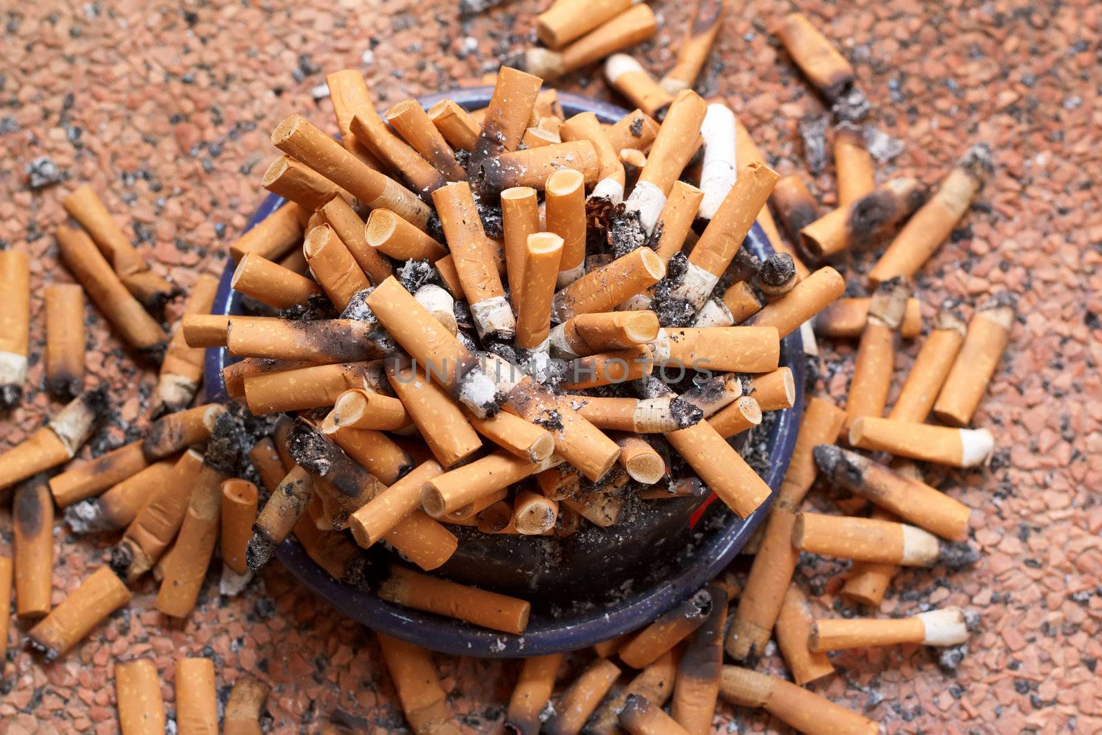 ashtray full of cigarettes close-up