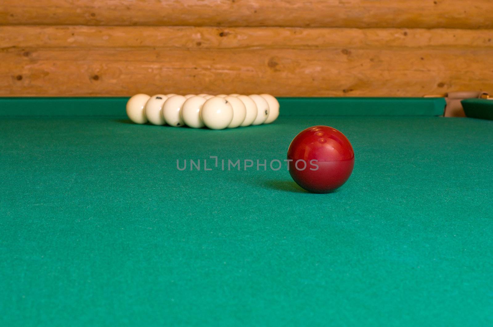 Balls for Russian billiards on a table with green baize.