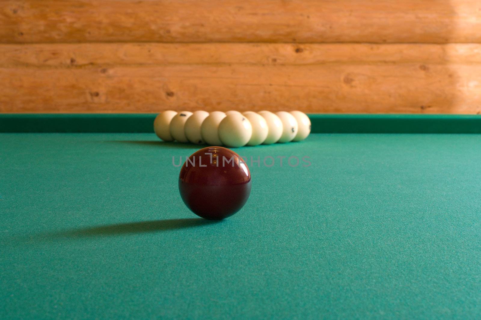 Balls for Russian billiards on a table with green baize.