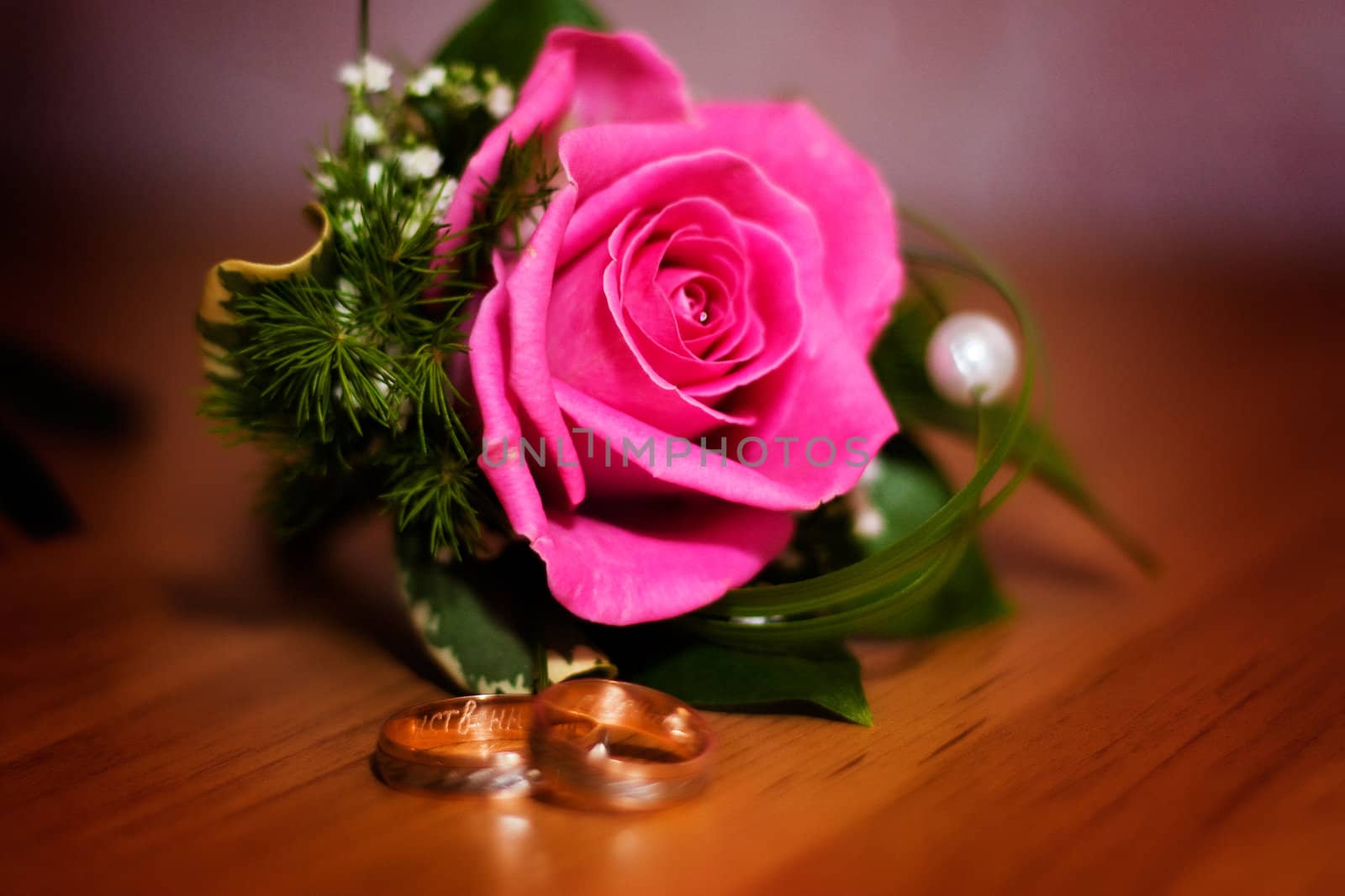 flower and wedding rings